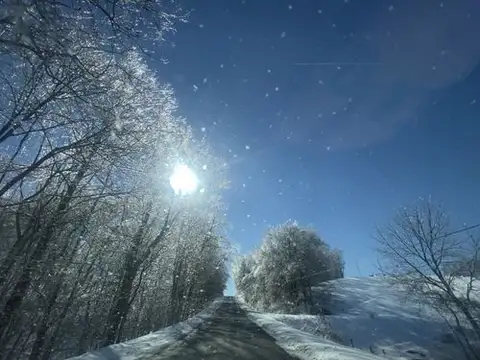 Chasing winter sun down a glittering road.